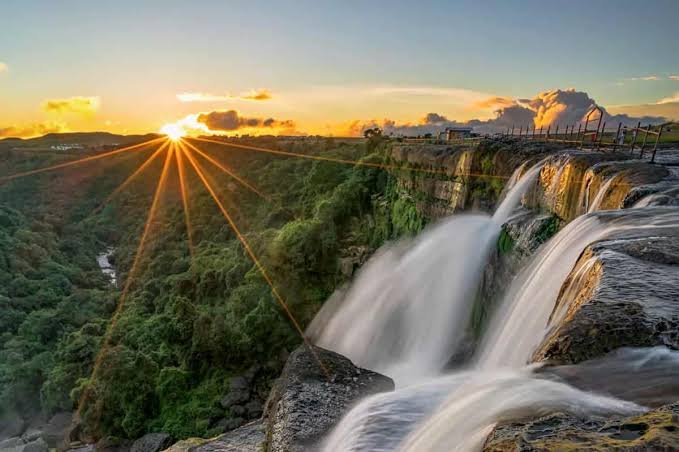 Sunset over waterfalls in Northeast India